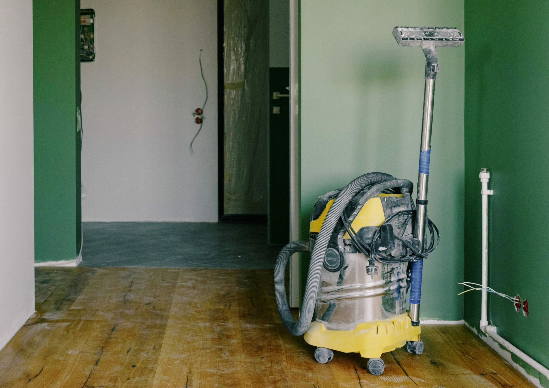 Vacuum cleaner placed in room